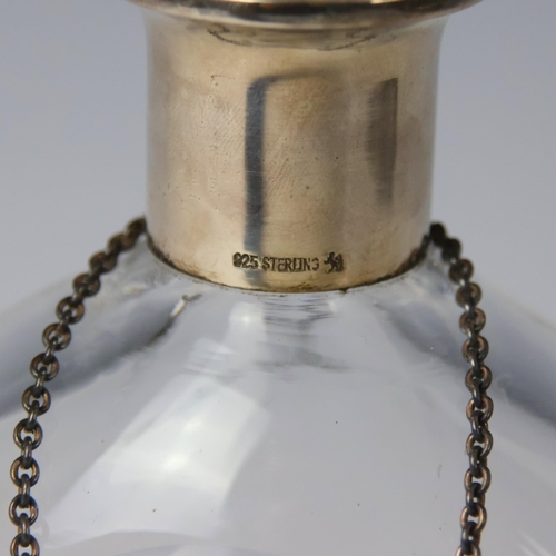 29 - A continental white metal mounted glass decanter, the semi circle glass stopper above plain polished... 