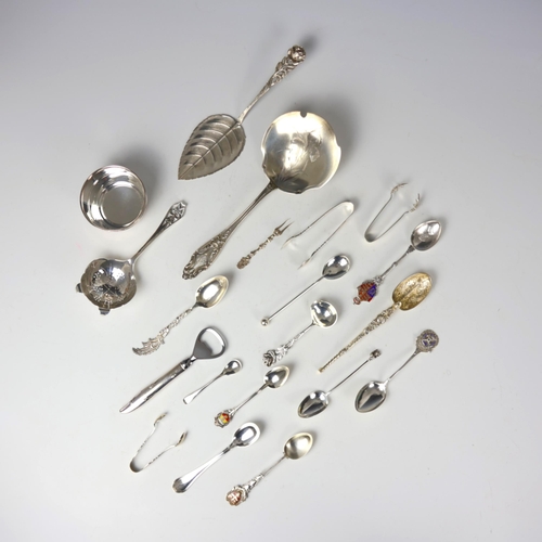 30 - A selection of silver, white metal and silver coloured flatware, including a near matched silver tea... 