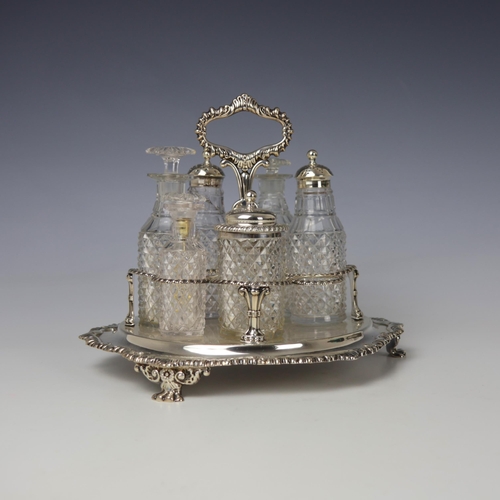 31 - A George III silver cruet stand, John and Thomas Settle, Sheffield 1814, the shaped handle with gadr... 