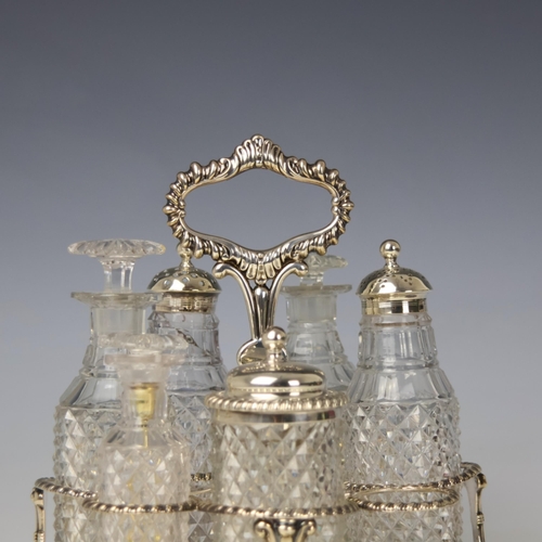 31 - A George III silver cruet stand, John and Thomas Settle, Sheffield 1814, the shaped handle with gadr... 