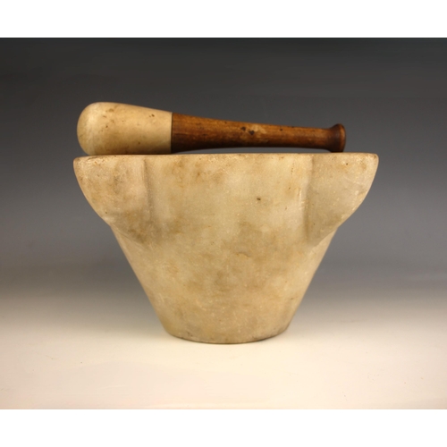 396 - A carved marble pestle and mortar of large proportions, 20th century, of typical form, the mortar wi... 