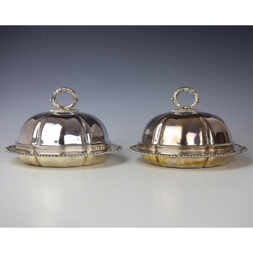9 - A pair of George IV silver vegetable dishes, Robert Garrard II, London 1825, the gadrooned rim above... 