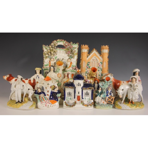 306 - A pair of Victorian Staffordshire cow creamers, mid 19th century, one modelled with a cowherd, the o... 