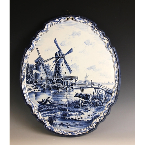 309 - A Tichelaar Makkum Delft blue and white wall plaque, 20th century, of shaped oval form with raised r... 