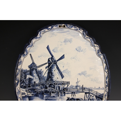 309 - A Tichelaar Makkum Delft blue and white wall plaque, 20th century, of shaped oval form with raised r... 