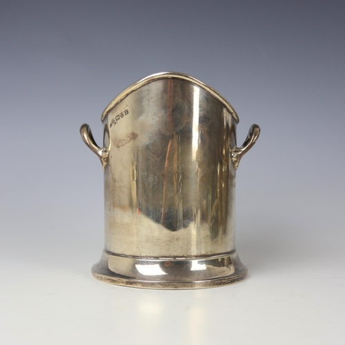 3 - A George V silver bottle sleeve, Barker Brothers, Chester 1923, the shaped rim above twin handles an... 