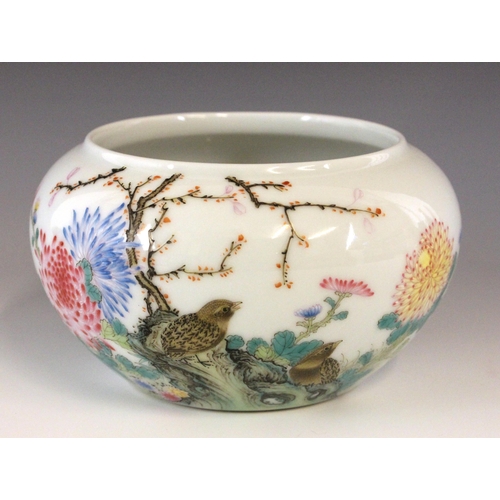 329 - A Chinese porcelain famille rose bowl, Qianlong seal mark, of compressed circular form and decorated... 