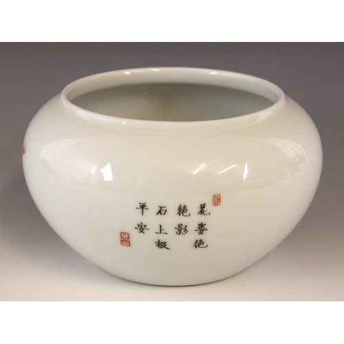 329 - A Chinese porcelain famille rose bowl, Qianlong seal mark, of compressed circular form and decorated... 