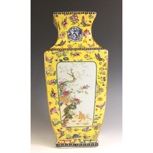 337 - A Chinese famille jaune vase, Qianlong four-character mark, the vase of baluster square section deco... 