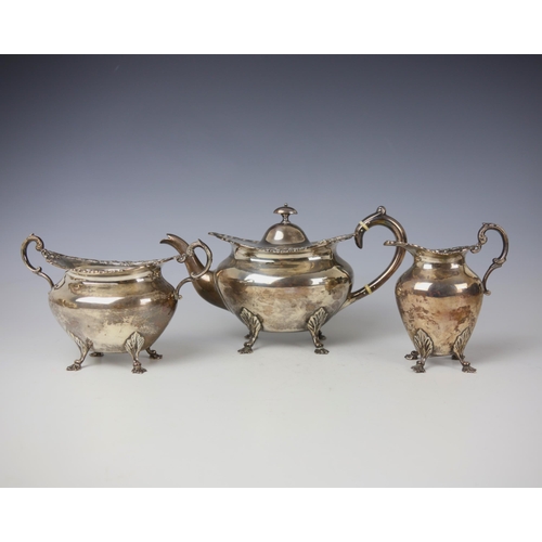 40 - An Edwardian silver three piece tea service, John Alexander Fettes, Glasgow 1901, comprising teapot,... 