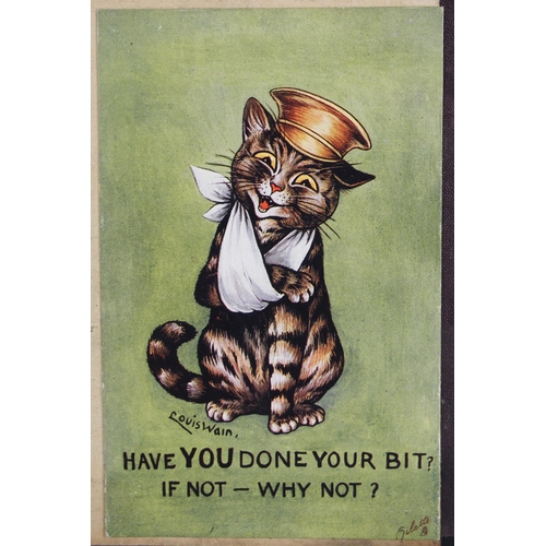 385 - A scrapbook of large proportions, early 20th century, to include a pasted down Louis Wain postcard, ... 