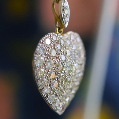 120 - A mid 20th century diamond heart pendant, the pendant set with forty six graduated round cut diamond... 