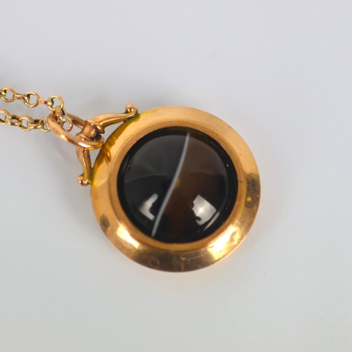 126 - A late 19th century banded agate pendant, the circular cabochon within plain polished mount, marked ... 