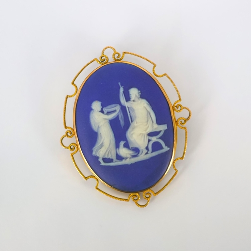 128 - A late 19th/early 20th century Wedgwood Jasperware brooch, the blue and white plaque depicting Zeus,... 