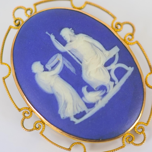 128 - A late 19th/early 20th century Wedgwood Jasperware brooch, the blue and white plaque depicting Zeus,... 