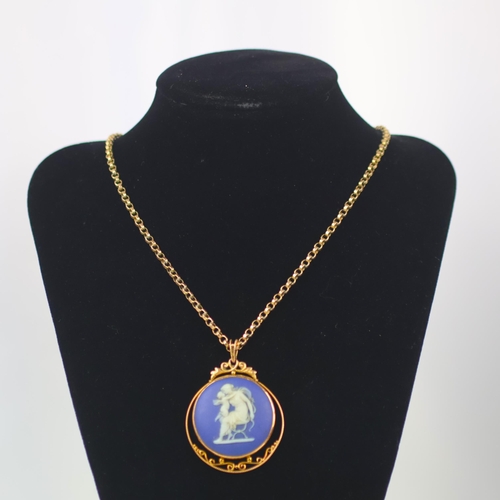 129 - A late 19th/early 20th century Wedgwood Jasperware pendant, the circular typical blue and white pend... 