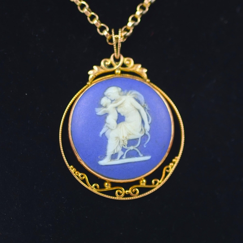 129 - A late 19th/early 20th century Wedgwood Jasperware pendant, the circular typical blue and white pend... 
