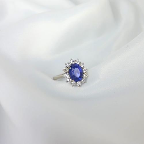 135 - A mid 20th century certified sapphire and diamond cluster ring, circa 1960, the oval sapphire within... 