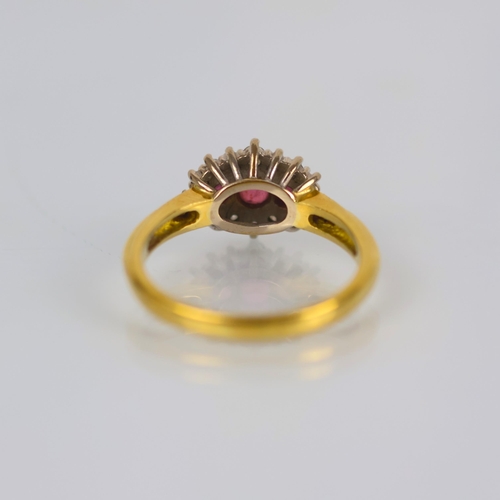 142 - A late 20th century 18ct yellow gold ruby and diamond dress ring, the central trio of round cut rubi... 