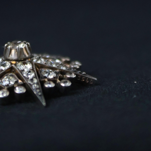 150 - A 19th century trio of diamond brooches converting to a tiara, hair combs and /or pendants, the thre... 