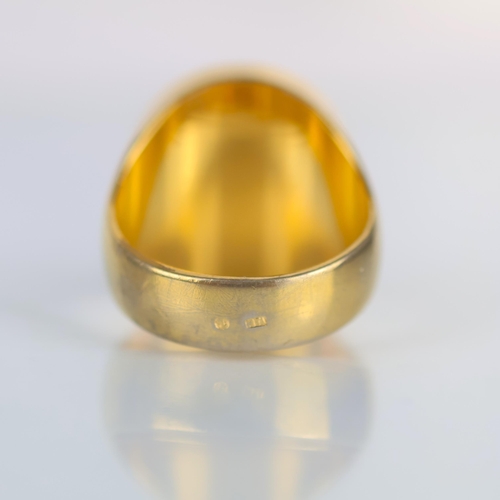 153 - A late 20th century gold plated 'coin' ring, the signet style ring set with a 'sovereign' style coin... 