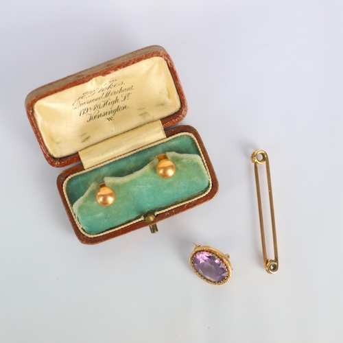 157 - A selection of jewellery, including an early 20th century amethyst brooch, the oval cut stone within... 