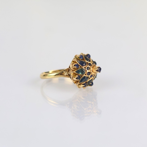 158 - A late 20th century 'Thai princess ring' the raised head set with various cuts of sapphires, with fa... 