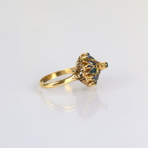 158 - A late 20th century 'Thai princess ring' the raised head set with various cuts of sapphires, with fa... 