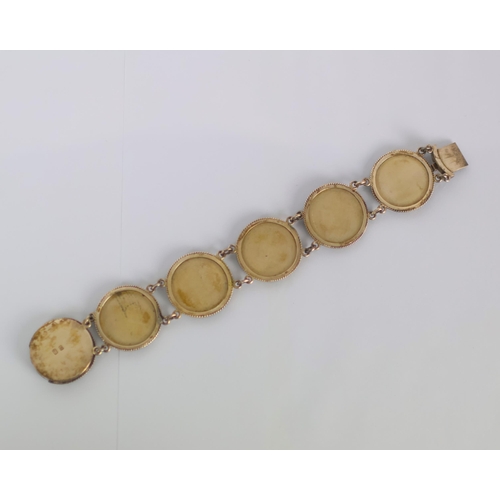 160 - A mid 20th century Japanese Shakudo bracelet, the six circular panels depicting scenes of cranes amo... 