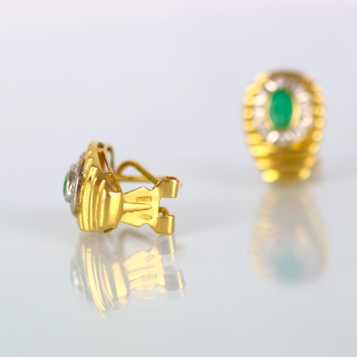 163 - A pair of late 20th century emerald and diamond earrings, the oval cut emeralds within border of eig... 