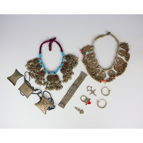 169 - A selection of jewellery, majority tribal, including a Turkish bracelet, set with turquoise coloured... 