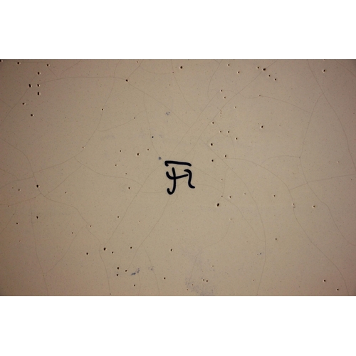 309 - A Tichelaar Makkum Delft blue and white wall plaque, 20th century, of shaped oval form with raised r... 