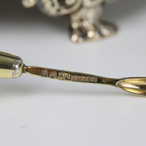 31 - A George III silver cruet stand, John and Thomas Settle, Sheffield 1814, the shaped handle with gadr... 