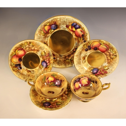 316 - A selection of Aynsley Orchard Gold tea wares, comprising two tea cups with gilt foot rims and handl... 