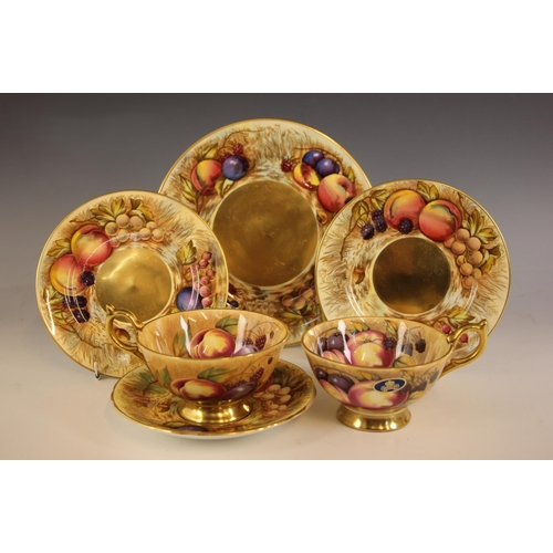 316 - A selection of Aynsley Orchard Gold tea wares, comprising two tea cups with gilt foot rims and handl... 