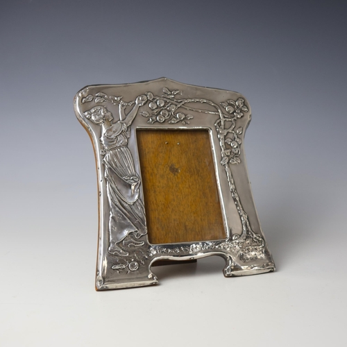 35 - An Edwardian silver mounted photograph frame, Charles S Green & Co Ltd, Birmingham 1904, the Arts an... 