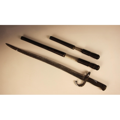 391 - A vintage East African tribal knife, probably from Malawi, the double edged blade set to a metal mou... 