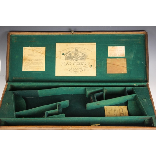 394 - A shotgun case by Charles Lancaster of London, 19th century, the wooden framed leather bound case wi... 