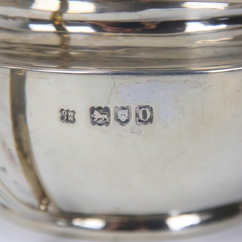 44 - An Edwardian silver milk jug and sugar bowl, Daniel & John Wellby, London 1909, the grooved angular ... 