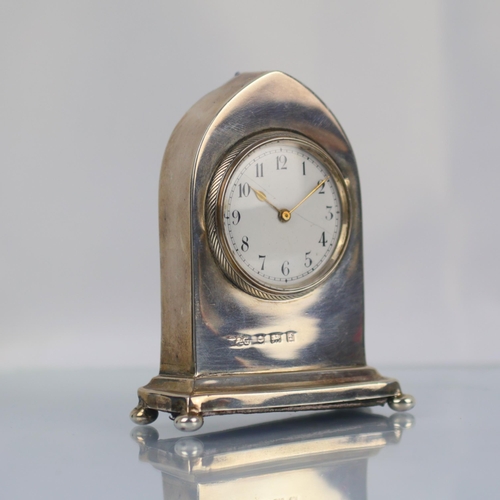 50 - An Edwardian silver mounted desk time piece, Wagner & Gerstley Ltd, Birmingham 1905, of arched form ... 