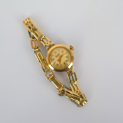 86A - A late 20th century 9ct gold cased ladies 'Everite' wristwatch, the circular cream coloured dial wit... 