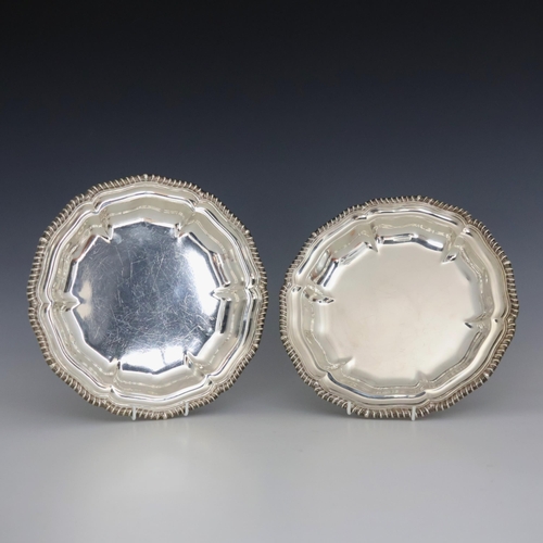 9 - A pair of George IV silver vegetable dishes, Robert Garrard II, London 1825, the gadrooned rim above... 