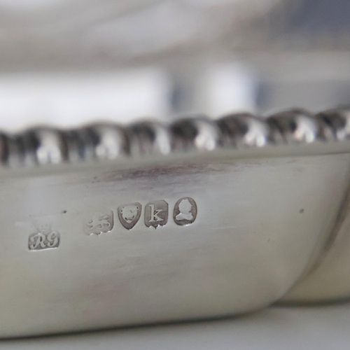 9 - A pair of George IV silver vegetable dishes, Robert Garrard II, London 1825, the gadrooned rim above... 