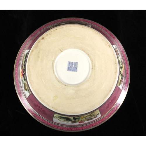 327 - A large Chinese porcelain famille rose centre bowl, Qianlong seal mark, of circular form and central... 