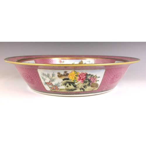 327 - A large Chinese porcelain famille rose centre bowl, Qianlong seal mark, of circular form and central... 