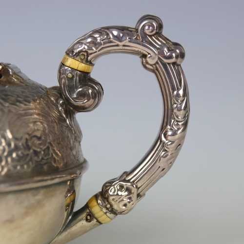 4 - A George IV silver teapot, Howard Battie and Hawksworth , Sheffield 1823, the cast fruit finial abov... 