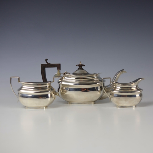70 - An Edwardian silver three piece tea service, Jones and Crompson, Birmingham 1909, comprising teapot,... 