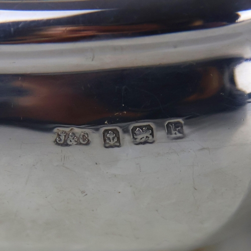 70 - An Edwardian silver three piece tea service, Jones and Crompson, Birmingham 1909, comprising teapot,... 