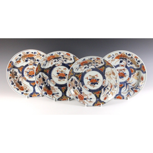 343 - A set of four Japanese Imari porcelain plates, Arita, 18th century, each of circular form and decora... 