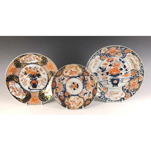 344 - A collection of Japanese Imari plates, Arita, 18th century, to include a pair, bearing Marchant Lond... 